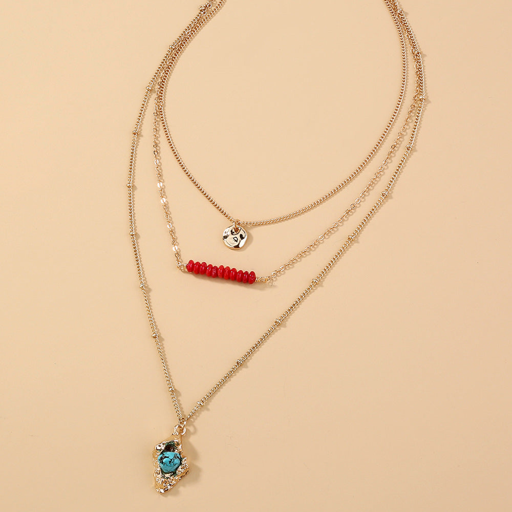 Collier bohème doré haricot corail rock