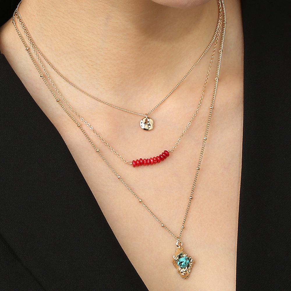 Collier bohème doré haricot corail rock