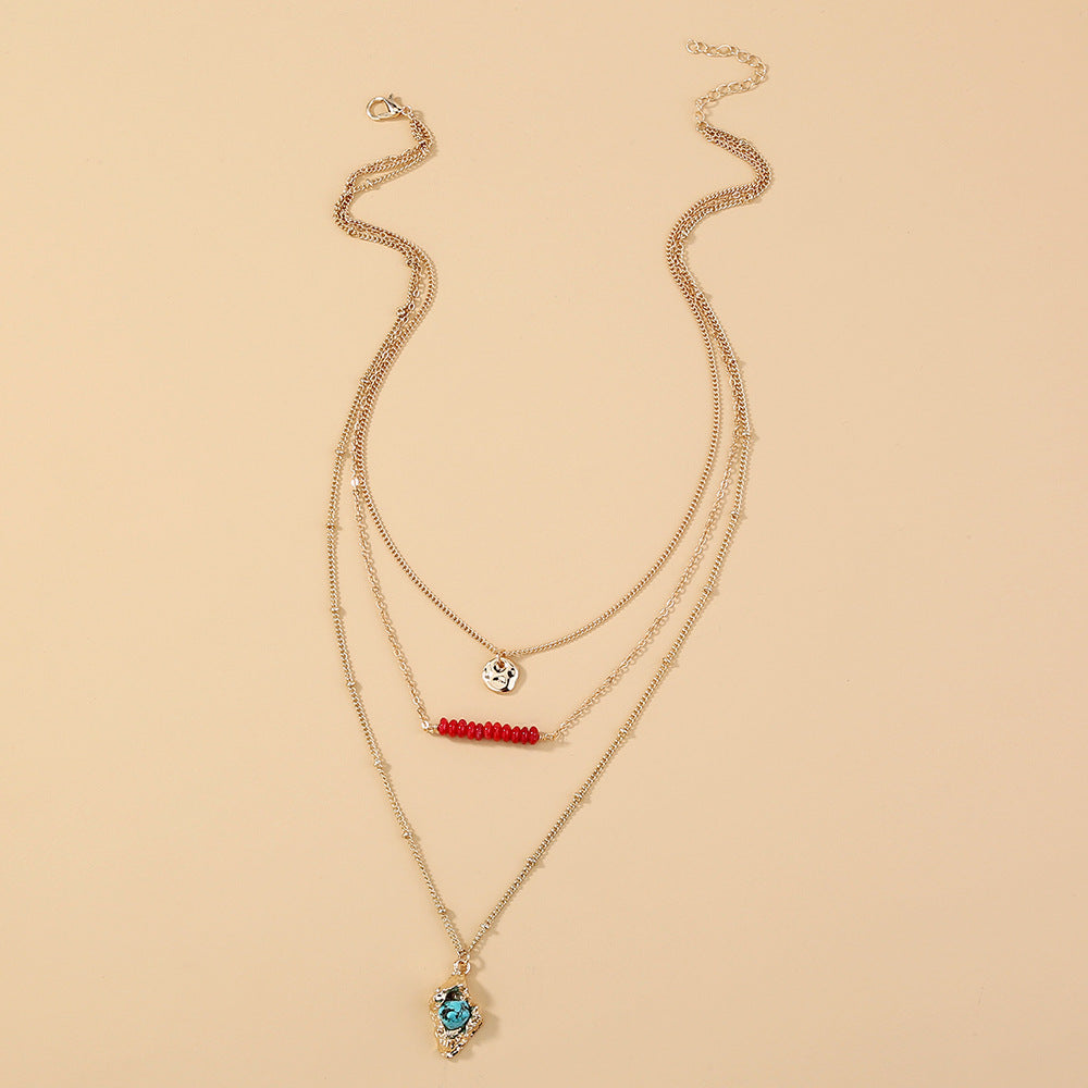 Collier bohème doré haricot corail rock