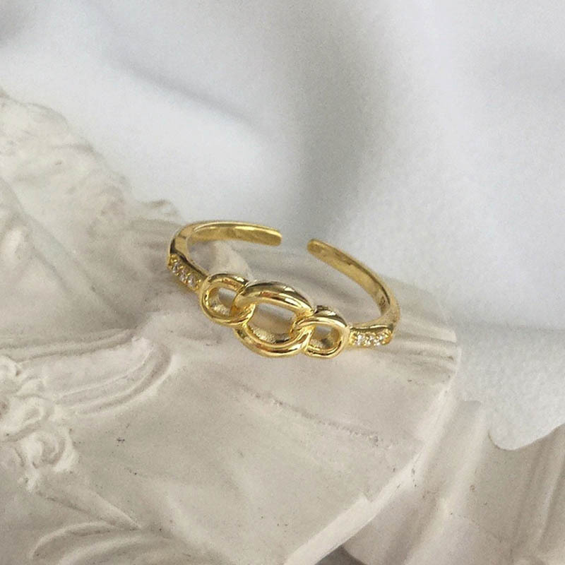 Interlocking Round Cut Sterling Silver Plated Gold Ring