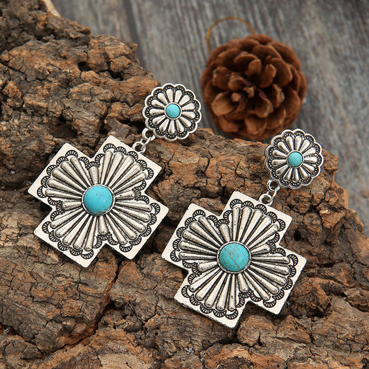 Carved Earrings From a Bohemian Cross