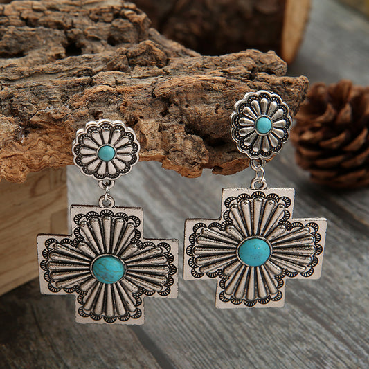 Carved Earrings From a Bohemian Cross